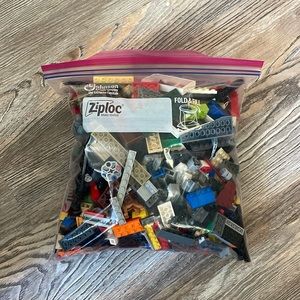 Gallon size zip lock bag of random legos.